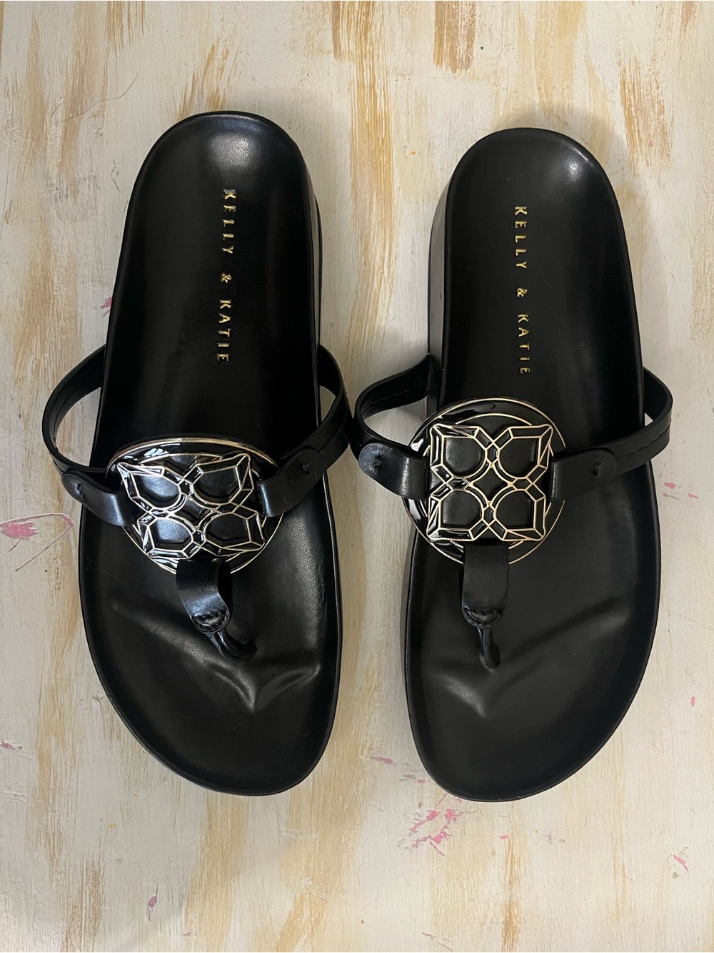 Kelly & Katie Black Thong Sandals with Gold Medallion